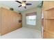 Bedroom featuring a built-in murphy bed, a window, and wall to wall shelving at 9630 Club South Cir # 6204, Sarasota, FL 34238