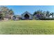 Well-manicured lawn leading to the community clubhouse at 9630 Club South Cir # 6204, Sarasota, FL 34238