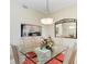 Dining area with glass table and views to the living area at 9630 Club South Cir # 6204, Sarasota, FL 34238