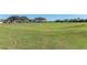 Scenic view of the rolling hills and lush greenery of the golf course at 9630 Club South Cir # 6204, Sarasota, FL 34238