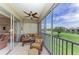 Enclosed lanai with tile floor, comfortable seating and a beautiful view of the golf course and pond at 9630 Club South Cir # 6204, Sarasota, FL 34238
