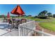 Outdoor patio featuring comfortable seating with views of the golf course and surrounding landscape at 9630 Club South Cir # 6204, Sarasota, FL 34238