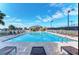 Outdoor pool area featuring lounge chairs, umbrellas, and clear blue water for relaxation at 9630 Club South Cir # 6204, Sarasota, FL 34238