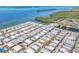 Aerial view of a well-maintained mobile home community, with lush landscaping and access to the waterfront at 10315 Cortez W Rd # 24H, Bradenton, FL 34210
