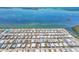 High aerial view of a dense waterfront community near a boat harbor and a waterway at 10315 Cortez W Rd # 24H, Bradenton, FL 34210