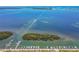 Aerial view of marina near island in clear blue water at 10315 Cortez W Rd # 24H, Bradenton, FL 34210