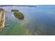 Aerial view of waterfront marina and island with boat docks and slips at 10315 Cortez W Rd # 24H, Bradenton, FL 34210