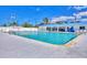 Large community pool with poolside seating offers a refreshing oasis for relaxation and recreation at 10315 Cortez W Rd # 24H, Bradenton, FL 34210