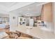 Efficient kitchen featuring a breakfast bar, bright lighting, and ample counter space at 10315 Cortez W Rd # 24H, Bradenton, FL 34210