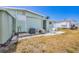 Back patio with white outdoor furniture and room for entertaining and enjoying the outdoors at 10315 Cortez W Rd # 24H, Bradenton, FL 34210