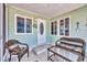 Cozy screened porch with wicker chairs, a glass top table, and views of the community at 10315 Cortez W Rd # 24H, Bradenton, FL 34210