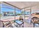 Comfortable screened porch with wicker furniture for outdoor relaxation with views at 10315 Cortez W Rd # 24H, Bradenton, FL 34210