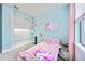 This pink and blue bedroom has closet space, decor, a bed, and natural light from a window at 11092 58Th Street Cir E, Parrish, FL 34219