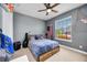 Cozy bedroom with a ceiling fan, natural light, and a simple design with contemporary accents at 11092 58Th Street Cir E, Parrish, FL 34219