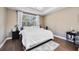 Comfortable bedroom with a tray ceiling, hardwood floors, and a cozy rug at 11092 58Th Street Cir E, Parrish, FL 34219