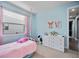 A delightful bedroom offers a comfy bed, a dresser, and a window with natural light at 11092 58Th Street Cir E, Parrish, FL 34219