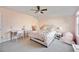 Bright bedroom features a hanging chair, desk, ceiling fan, and a spacious layout at 11092 58Th Street Cir E, Parrish, FL 34219