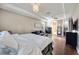 A spacious primary bedroom with a tray ceiling, fan, recessed lighting and hardwood floors at 11092 58Th Street Cir E, Parrish, FL 34219