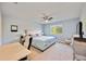 Bedroom with ceiling fan, a double bed, large window, and desk at 11092 58Th Street Cir E, Parrish, FL 34219