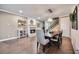 Elegant dining area featuring a cozy fireplace, chandelier lighting, and a large table at 11092 58Th Street Cir E, Parrish, FL 34219