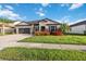 Beautiful single Gathering home with vibrant landscaping, lawn and a two-car garage at 11092 58Th Street Cir E, Parrish, FL 34219