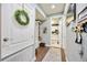 A modern hallway offers storage cubbies, a wreath, and access to other rooms at 11092 58Th Street Cir E, Parrish, FL 34219