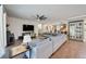 Cozy living room featuring a large sectional sofa, hardwood floors, and modern decor at 11092 58Th Street Cir E, Parrish, FL 34219