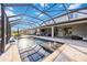 A screened-in pool features fountains, an integrated spa, and ample seating space at 11092 58Th Street Cir E, Parrish, FL 34219