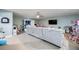 Open recreation room filled with furniture, toys, tv and large couch at 11092 58Th Street Cir E, Parrish, FL 34219