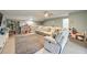 Spacious living area with sectional couch, carpet, and toys at 11092 58Th Street Cir E, Parrish, FL 34219