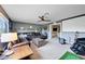 Large recreation room with carpet, tv, fan, sectional couch and guitar at 11092 58Th Street Cir E, Parrish, FL 34219
