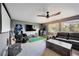 Recreation room with carpet, fan, and a leather couch at 11092 58Th Street Cir E, Parrish, FL 34219