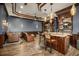 Basement wet bar with seating and a TV area with comfortable seating at 12224 Garden Lake Cir, Odessa, FL 33556