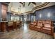 Finished basement has a stylish bar area and comfortable home theater seating at 12224 Garden Lake Cir, Odessa, FL 33556