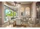 Cozy breakfast nook with pool views, decorative mirrors, and comfortable seating at 12224 Garden Lake Cir, Odessa, FL 33556