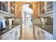 Convenient butler's pantry with ample cabinetry and countertop space at 12224 Garden Lake Cir, Odessa, FL 33556