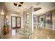 Elegant foyer with soaring ceilings, decorative lighting, and marble flooring with inlay at 12224 Garden Lake Cir, Odessa, FL 33556