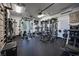 Bright home gym with rubber floors, modern equipment, and a window to let in natural light for exercising at 12224 Garden Lake Cir, Odessa, FL 33556