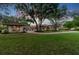 Lush landscaping complements the home's exterior in a tranquil, serene setting at 12224 Garden Lake Cir, Odessa, FL 33556