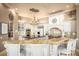 Elegant kitchen with a spacious island, granite countertops, and stainless steel appliances at 12224 Garden Lake Cir, Odessa, FL 33556