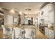 Elegant kitchen with a spacious island, granite countertops, and stainless steel appliances at 12224 Garden Lake Cir, Odessa, FL 33556