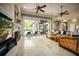 Bright living room with fireplace and sliding doors to the patio at 12224 Garden Lake Cir, Odessa, FL 33556