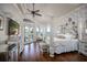 Luxurious main bedroom with patio access, elegant decor, and stylish furnishings at 12224 Garden Lake Cir, Odessa, FL 33556
