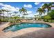 Gorgeous backyard swimming pool and outdoor area overlooking a scenic lake view at 12224 Garden Lake Cir, Odessa, FL 33556
