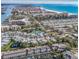 Stunning aerial view of waterfront community with beaches, docks and residences on a clear, sunny day at 1235 Dockside Place # 108, Sarasota, FL 34242