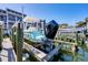 Waterfront property with boat lift, providing convenient access to the water for boating enthusiasts at 1235 Dockside Place # 108, Sarasota, FL 34242
