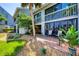 Exterior of home shows a patio with seating and lush landscaping, perfect for enjoying outdoor living at 1235 Dockside Place # 108, Sarasota, FL 34242