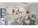 Well-lit kitchen features sleek countertops, modern appliances, and charming barstool seating for a modern touch at 1235 Dockside Place # 108, Sarasota, FL 34242