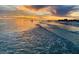 Stunning sunset over a calm ocean, creating a serene and tranquil atmosphere with beach access at 1235 Dockside Place # 108, Sarasota, FL 34242