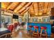 Large recreational room with bar, stools, and seating offering a welcoming gathering space at 1235 Dockside Place # 108, Sarasota, FL 34242